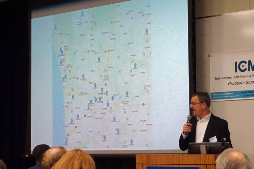 Dr. Richard Jelier, Director of the School of Public, Nonprofit and Health Administration, with the attendance map